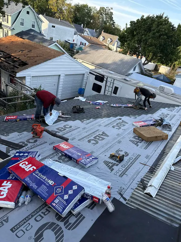 Right Deal Construction crew installing GAF shingles